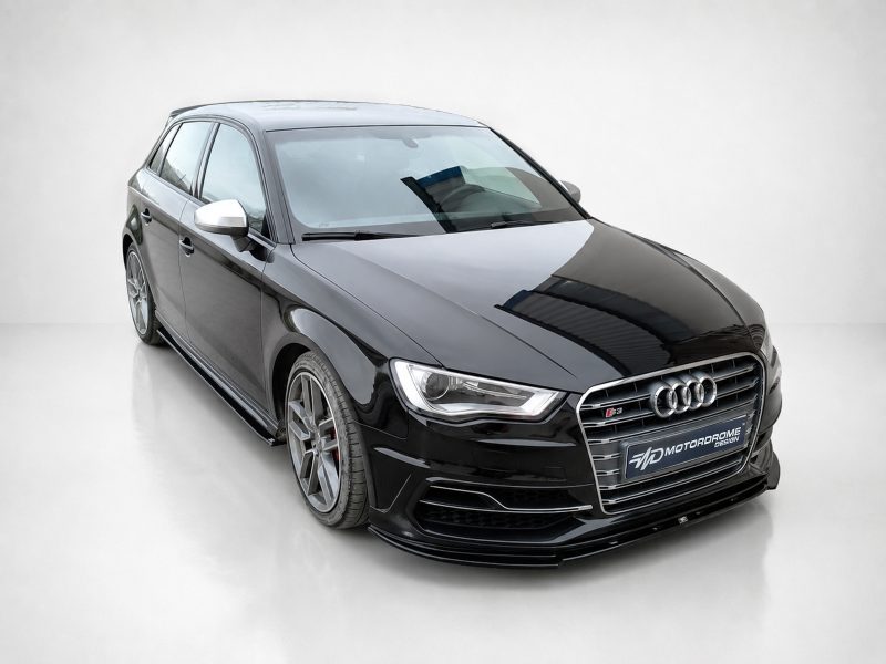 Black Audi sedan shown in a angled front-left view, chrome grille, and alloy wheels on a light background.
