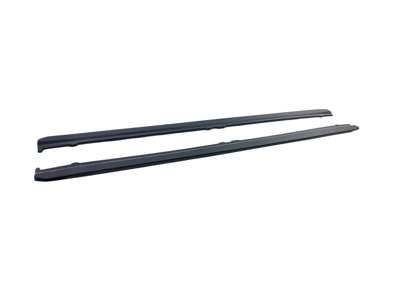 K187-002_5jpg - OPSHOLDERS Two black windshield wiper blades laid side by side on a white background