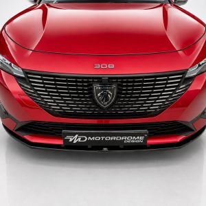 Front view of a red Peugeot 308 showing the grille, badge, and headlights in a studio setting