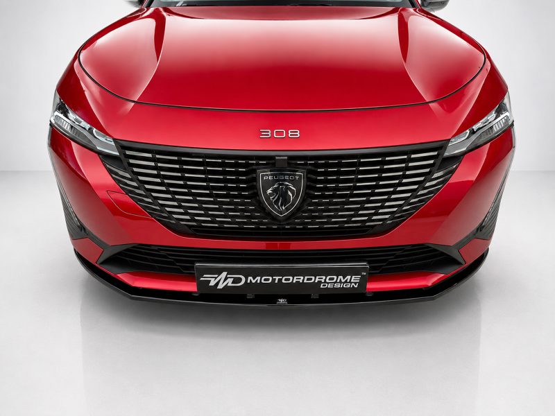 Front view of a red Peugeot 308 showing the grille, badge, and headlights in a studio setting