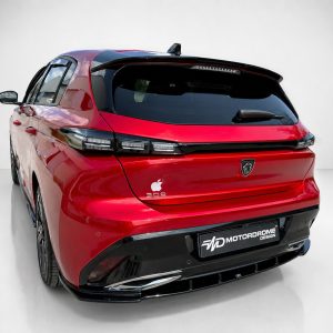 K189-003_2jpg - OPSHOLDERS Rear three-quarters view of a red Peugeot SUV in a studio, highlighting black spoiler, LED taillights, and a Motordrome Design plate.
