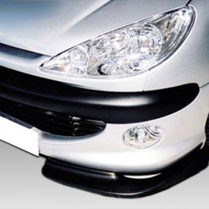 Front end of a silver Peugeot car showing the headlight, grille with the lion emblem, and a black lower bumper lip.