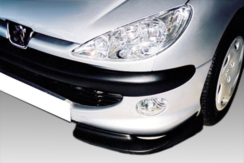 K19-001_1jpg - OPSHOLDERS Front end of a silver Peugeot car showing the headlight, grille with the lion emblem, and a black lower bumper lip.