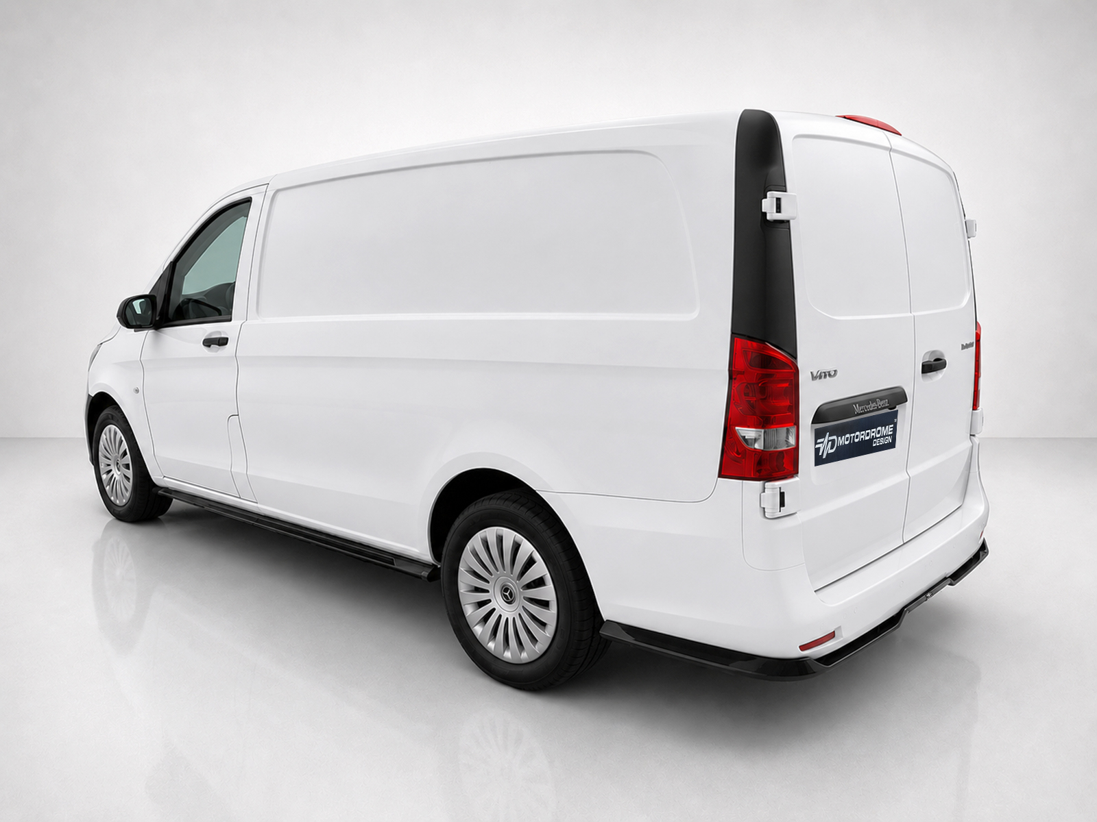 K190-004_2-1jpg - OPSHOLDERS White cargo van shown from a rear-left angle with closed back doors in a studio setting, blank sides for branding.