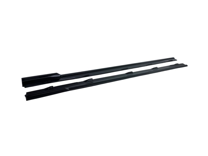 Pair of black windshield wiper blades laid diagonally, ready for installation on a car windshield