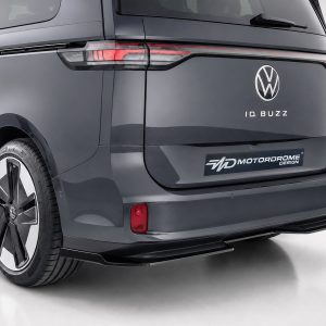Rear view of a dark gray VW ID. BUZZ concept minivan, showing the tailgate badge and slim horizontal taillight strip.