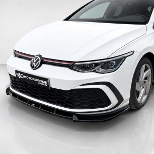 K192-001_3jpg - OPSHOLDERS Front three-quarter view of a white VW GTI with honeycomb grille in a studio setting.