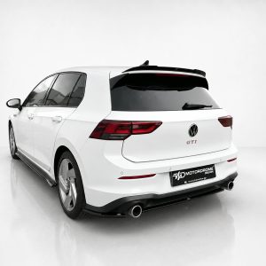 White Volkswagen GTI wagon shown from the rear three-quarter view, featuring a sport rear bumper and dual exhausts, in a clean studio setting.