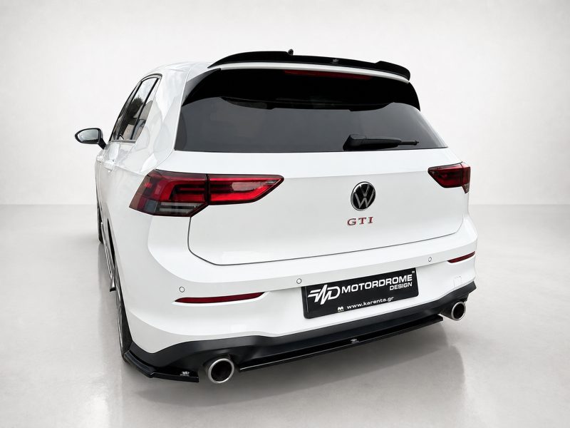 K192-004_3jpg - OPSHOLDERS White Volkswagen SUV rear view with GTI badge and aftermarket M MotorDrome plate, in a studio setting