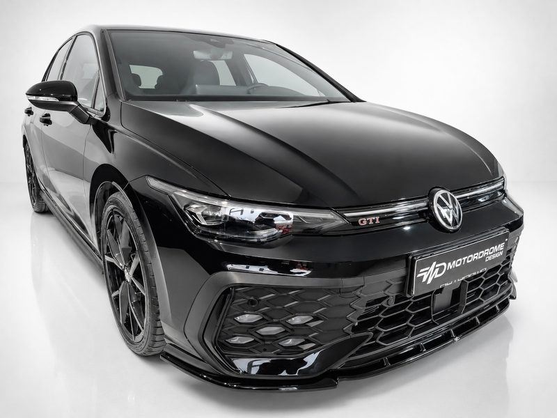 Front-left view of a glossy black Volkswagen GTI in a studio, showcasing its aggressive grille and LED headlights.