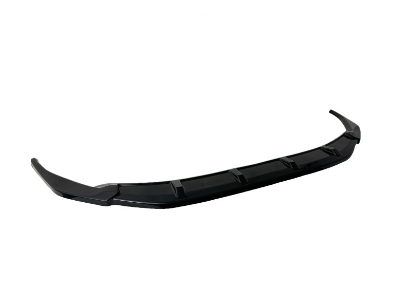 Black automotive front lip spoiler with angular fins, designed to mount to a vehicle’s bumper for aerodynamics and downforce.