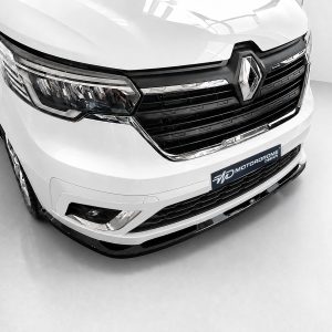 Front view of a white vehicle with a prominent black grille and Renault emblem on the hood.