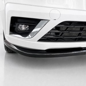 Close-up of the front left corner of a white car, showing the headlight, grille, and lower bumper lip on a clean surface.