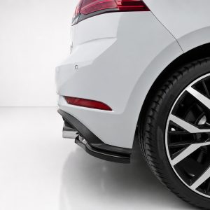 K196-003_4jpg - OPSHOLDERS Rear-right corner of a white car showing the taillight, bumper, and large alloy wheel with a VW logo
