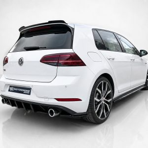 K196-004_4jpg - OPSHOLDERS Rear three-quarter view of a white modified VW hatchback in a studio, showing a rear diffuser, dual exhausts, and large wheels