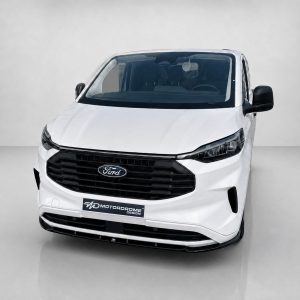 Front view of a white Ford van with a black grille and Motordrome Design plate on the bumper