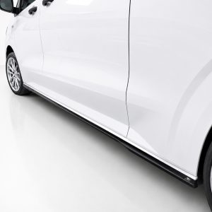 White car shown from the side, featuring doors, a black running board, and alloy wheels along the bottom edge.