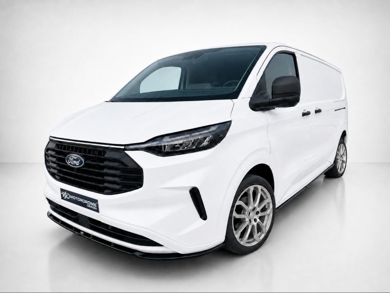 Front three-quarter view of a white Ford cargo van in a studio setting, showing the grille and headlights.