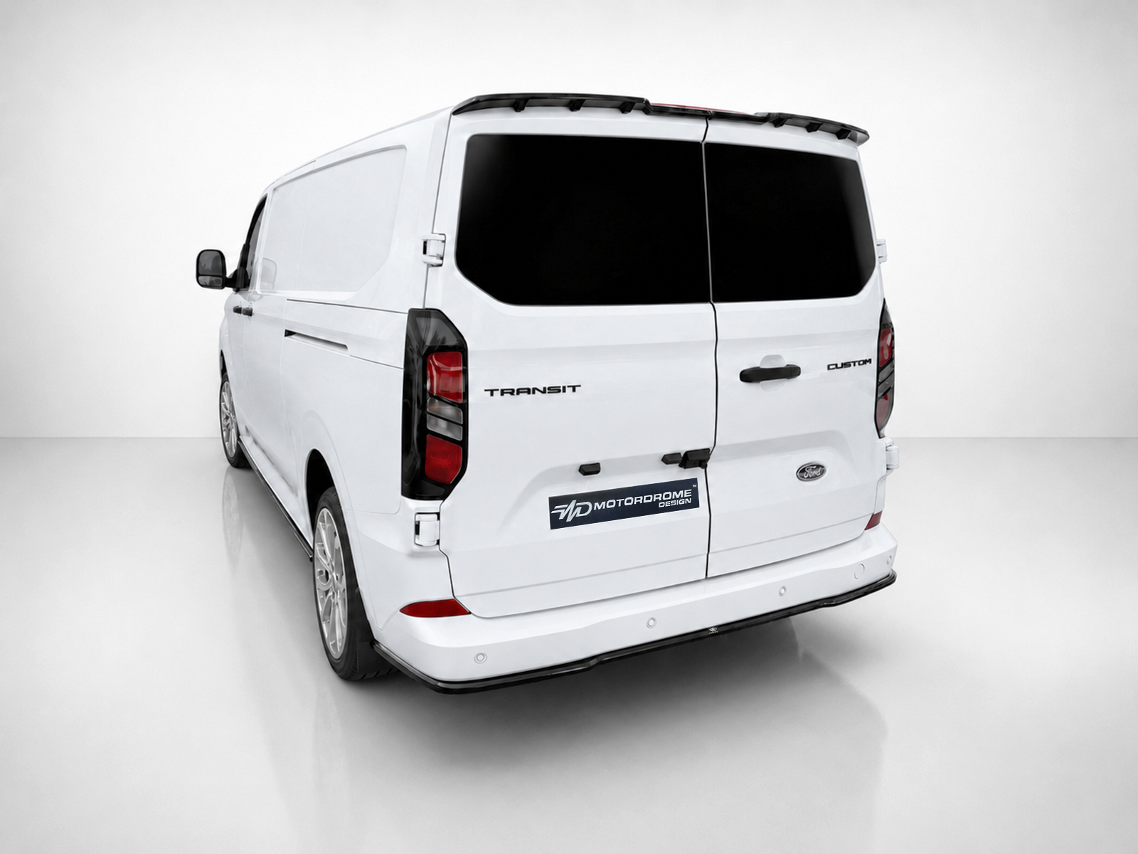 K200-003_1jpg - OPSHOLDERS Rear view of a white Ford Transit Custom cargo van with double doors and black-tinted rear windows in a studio setting.