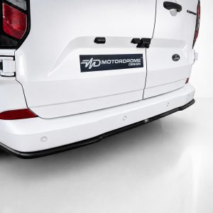 K200-003_3jpg - OPSHOLDERS White van rear with a dark logo decal reading 'MD MotorDrome Design' on the tailgate, Ford badge visible, and a black rear bumper protector edge.