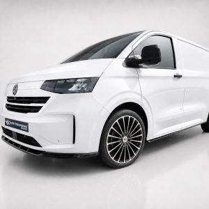 White modern cargo van with large black-rimmed wheels and red brake calipers, angled three-quarter view.