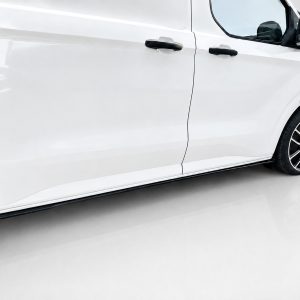 White panel van shown from the side with two black door handles and alloy wheels on a glossy floor