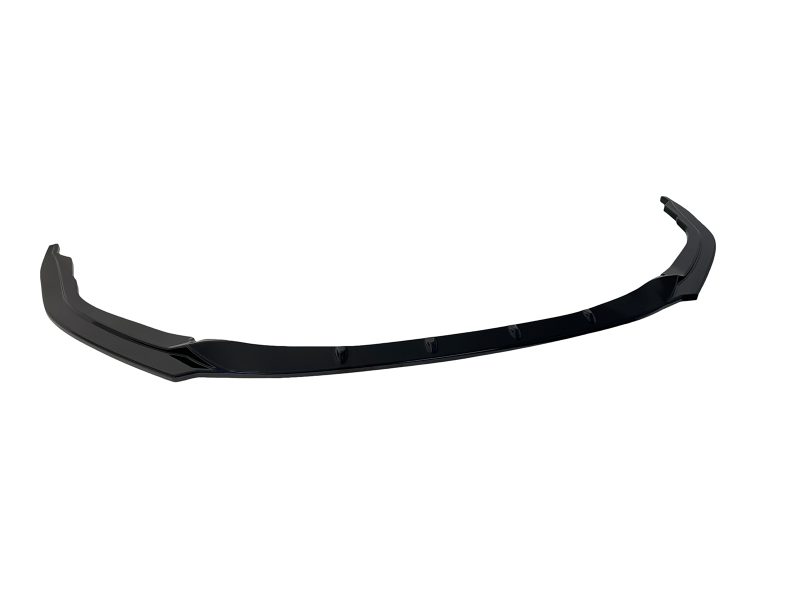 Black curved front bumper lip spoiler with mounting tabs, designed to improve aerodynamics and intake airflow on a car.