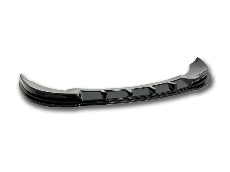 Glossy black car front bumper lip spoiler with aerodynamic fins against a white background