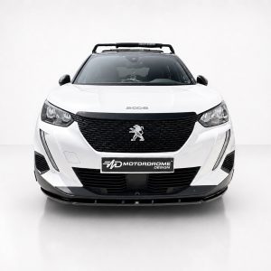 Front view of a white Peugeot 2008 with a black grille and emblem, parked in a studio.