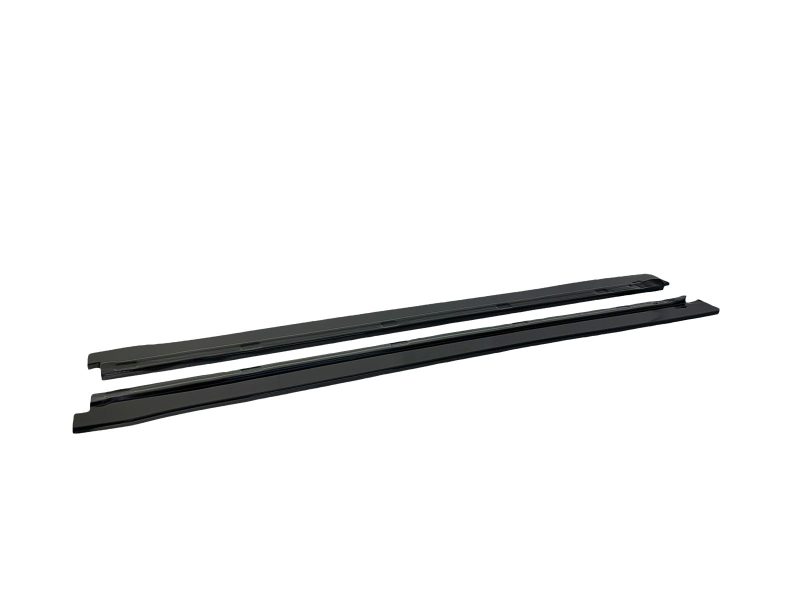 Pair of black windshield wiper blades lying parallel on a white background