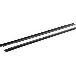 Two black windshield wiper blades lying parallel on a white surface, shown from a slight angle.