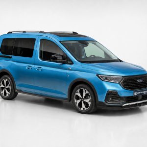 Blue Ford van shown from a front-three-quarter view in a studio, with black grille and roof rails