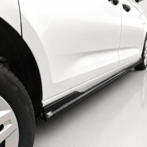 White SUV shown from the side with a running board along the lower body edge and a visible front tire.