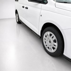 White van shown from the side with a running board and wheel visible on a light gray floor surface.