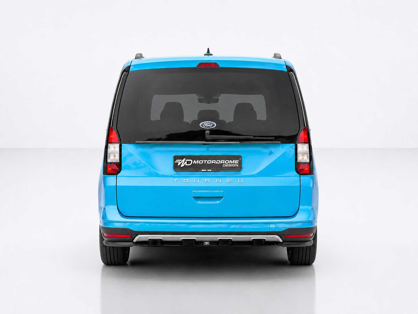 K205-003_2jpg - OPSHOLDERS Rear view of a bright blue Ford Tourneo minivan in a studio, showing the Motordrome Design plate on the tailgate.