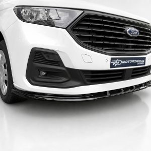 Front-left view of a white Ford van showing the front grille, headlight, and MDT Motordrome Design plate on the bumper