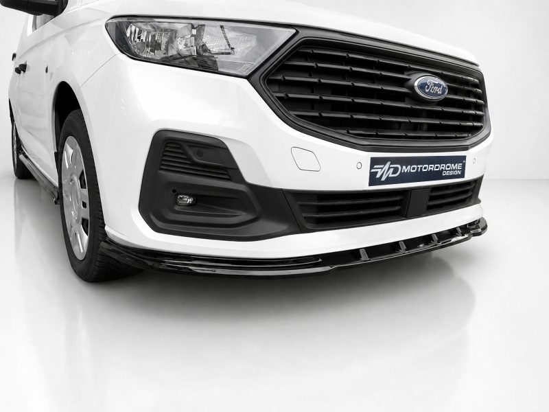 Front-left view of a white Ford van showing the front grille, headlight, and MDT Motordrome Design plate on the bumper