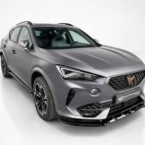 Silver SUV shown in a three-quarter front view with black mesh grille and sharp headlights in a white studio setting.