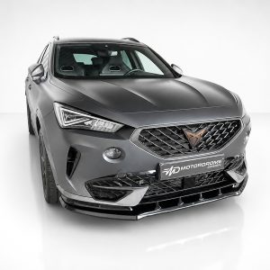 Front three-quarter view of a gray SUV in a white studio, featuring a diamond-pattern grille and Motordrome Design badge