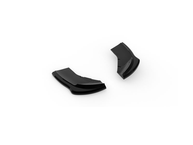 Two black glossy curved fragments lying on a white background, separated apart.