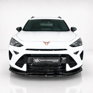 Front view of a white sports car in a studio, with a black lower grille and Motordrome Design plate on the bumper