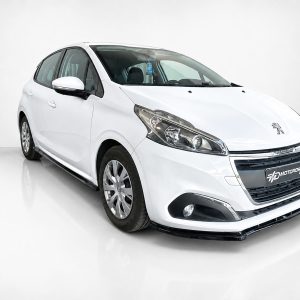 K209-002_2jpg - OPSHOLDERS White Peugeot hatchback shown at a three-quarter angle in a bright studio setting with a glossy floor surface.