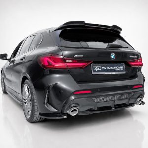 K210-004_2jpg - OPSHOLDERS Rear view of a black BMW M135i xDrive in a white studio, showing prominent taillights and dual exhausts with a Motordrome Design plate