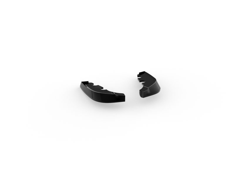 K210-004_3jpg - OPSHOLDERS Two glossy black curved plastic fragments with jagged inner edges on a white background, separated apart.