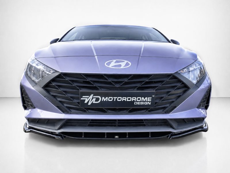 Front view of a purple Hyundai sedan with a large black grille and Motordrome Design license plate visible on the bumper.