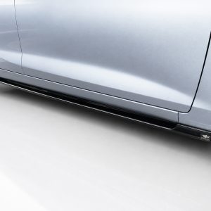 Side view of a silver car showing a black aftermarket side skirt along the bottom of the door under the body.