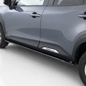 Side view of a blue Toyota Yaris Cross SUV focusing on the front and rear doors and running board with prominent Yaris Cross badge on the side step