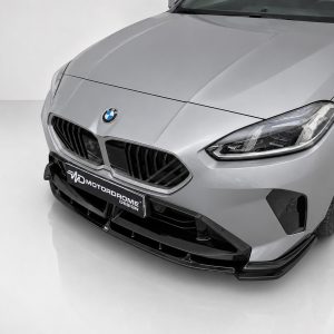 Front view of a silver BMW with distinctive kidney grille and LED headlights in a studio setting.
