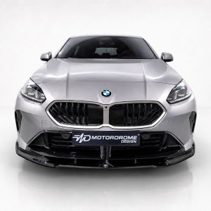 Front view of a silver BMW in a bright studio, featuring the distinctive kidney grille and logo