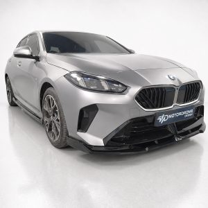 Front three-quarter view of a silver BMW sedan in a bright studio showroomoulet.